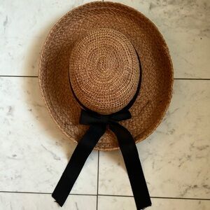 Beautiful raffia hat by Helen Kaminsky. Color has a touch of rust.